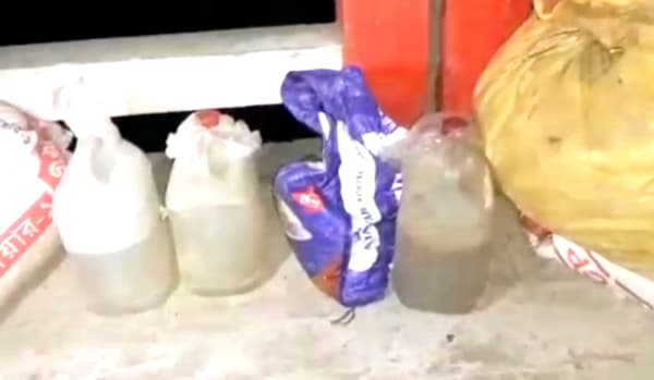 বিরামপুরে চোলাই মদের বড় চালান জব্দ, নদীতে ধ্বংস