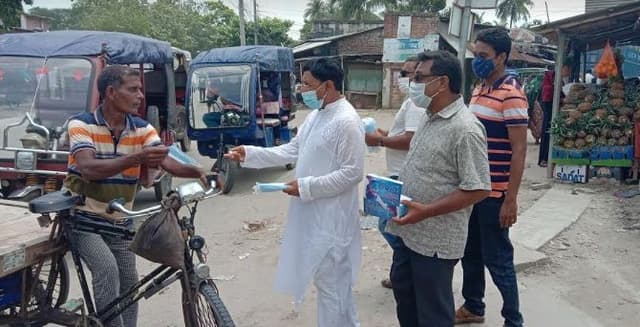 লালপুরে করোনা প্রতিরোধে প্রচার অভিযান ও মাস্ক বিতরণ