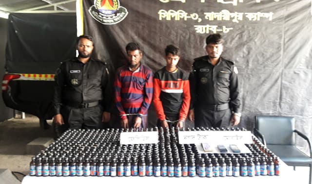 মাদারীপুরে ফেনসিডিল, ট্রাকসহ ২ জন গ্রেফতার